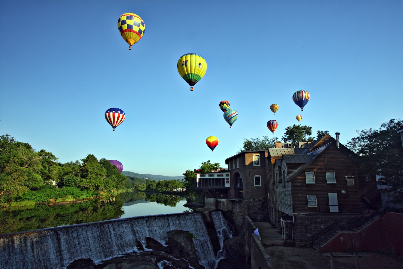 Balloons over the river during the Quechee Balloon Festival in Vermont
